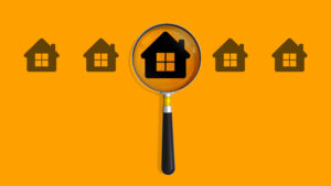 Woning onder vergrootglas als symbool voor waarde en keuze