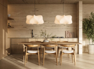 Houten eettafel met stoelen onder zachte hanglampen in een rustige, natuurlijk ingerichte keuken.